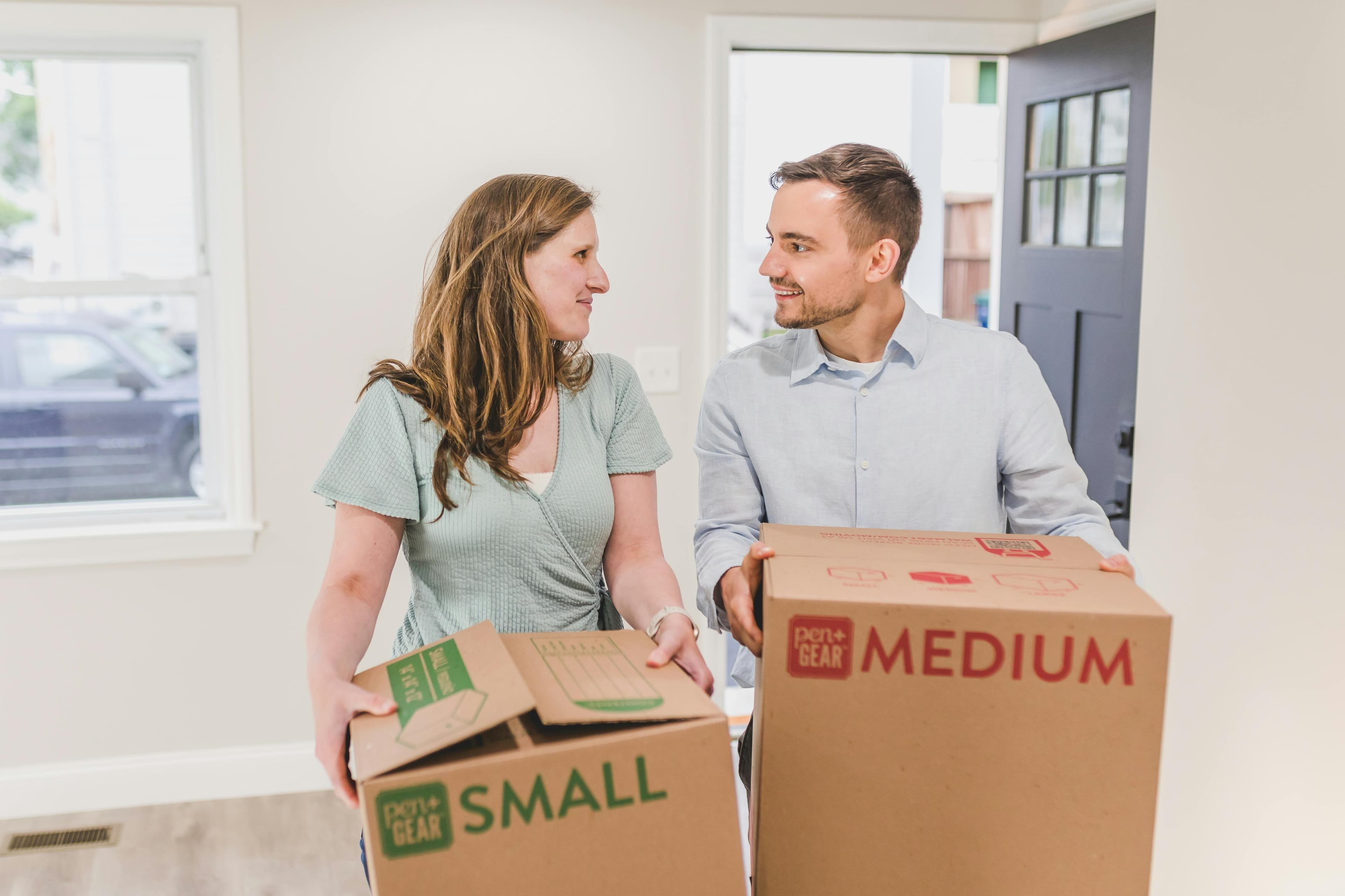 Couple packing boxes during a relocation move